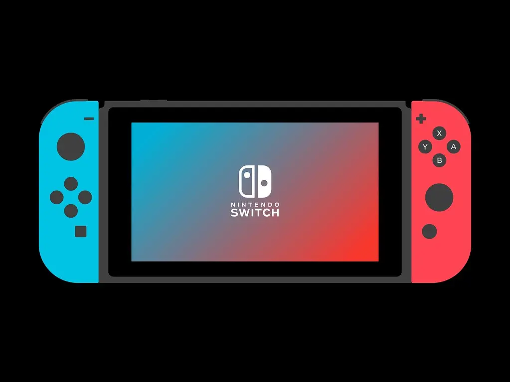 Een Nintendo Switch spelcomputer met blauwe en rode Joy-Con controllers op een zwarte achtergrond.